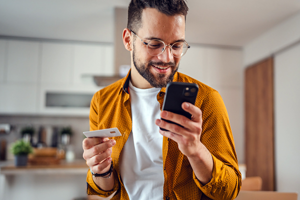 interior-inset-man-on-phone-with-credit-card