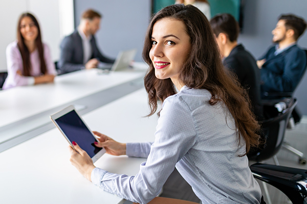 interior-inset-woman-with-tablet-in-business-meeting