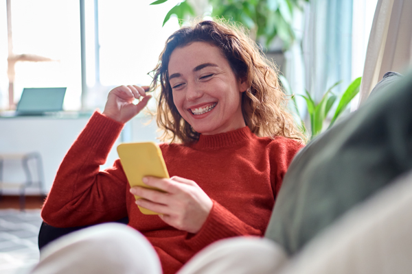 interior-inset-young-woman-looking-at-phone